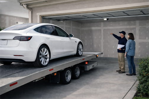 Electrician consulting first-time EV owner about home charger installation