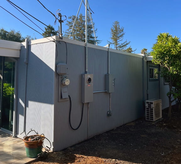 Exterior electrical service location on an older East Bay home
